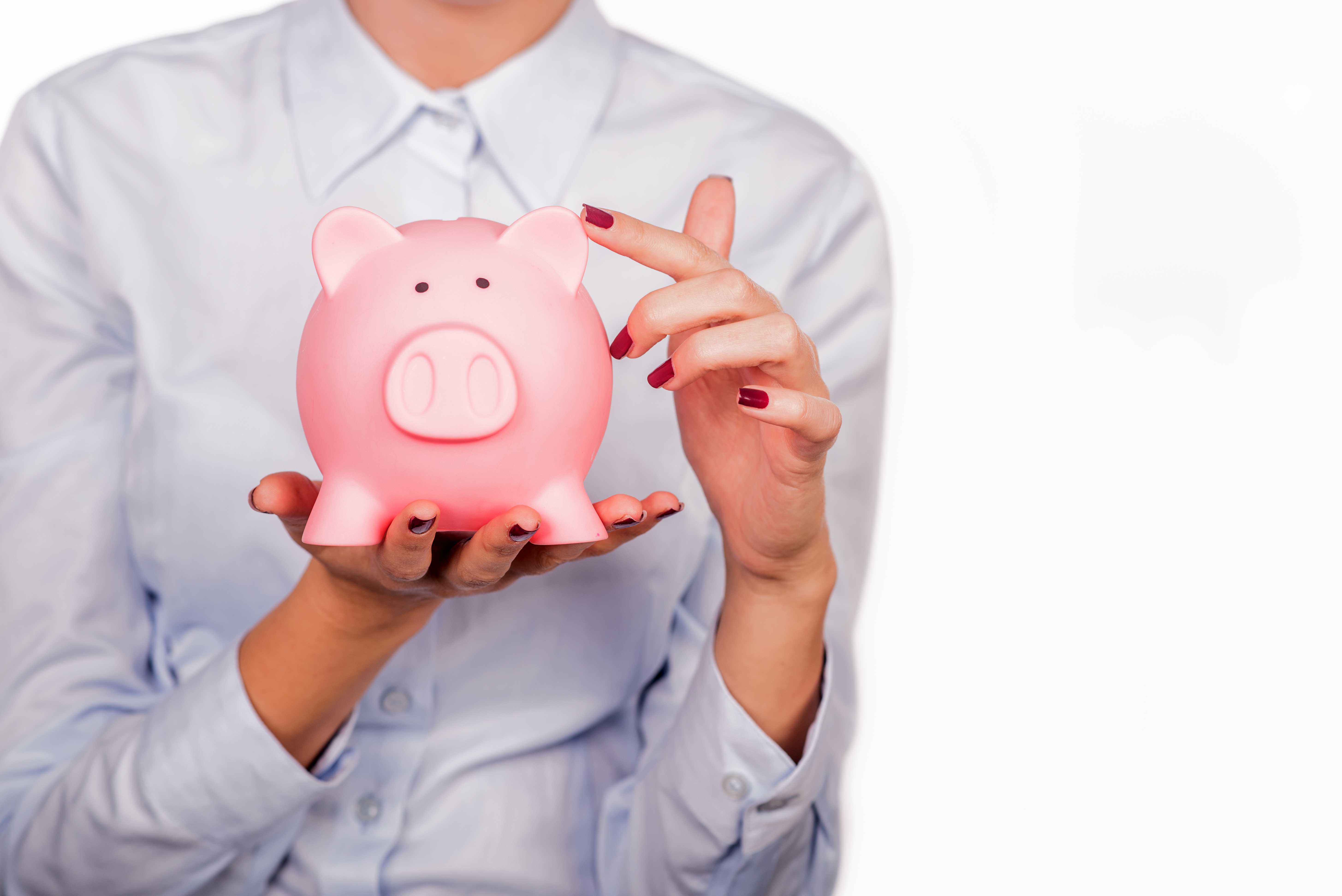 Woman holding piggy bank save money